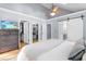 Large main bedroom with high ceilings, ceiling fan, walk-in closets, and private bathroom at 1023 Kent St, Durham, NC 27707