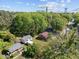 Overhead view captures this home nestled among lush greenery and neighboring houses, offering a serene setting at 105 E Murray Ave, Durham, NC 27704