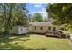 Lush backyard featuring a deck, shed, and ample green space at 105 E Murray Ave, Durham, NC 27704