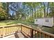 Spacious backyard with a lush green lawn and a charming storage shed at 105 E Murray Ave, Durham, NC 27704