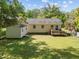 A well-maintained backyard features a small shed and a wooden deck perfect for outdoor enjoyment at 105 E Murray Ave, Durham, NC 27704