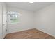 Light and airy bedroom with a window, wood laminate flooring, and a closet on the left at 105 E Murray Ave, Durham, NC 27704