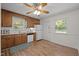 Functional kitchen featuring wood cabinets, white appliances, and hardwood floors at 105 E Murray Ave, Durham, NC 27704