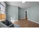 Inviting living room with a light-colored sofa, wood floors, and lots of natural light at 105 E Murray Ave, Durham, NC 27704