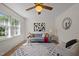 Inviting living room featuring a comfortable gray couch, modern decor, and a ceiling fan at 105 E Murray Ave, Durham, NC 27704
