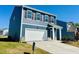 Beautiful two-story home featuring a two-car garage, covered entry, and well-maintained lawn at 107 Gabriel Ct, Wilson's Mills, NC 27520