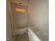 A bright bathroom features neutral walls and a covered shower stall at 107 Tee Dr, Selma, NC 27576