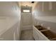 Well-lit unfinished bathroom with a bathtub and an unfinished vanity, showcasing potential for customization at 107 Tee Dr, Selma, NC 27576