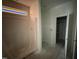 View of a bright bathroom featuring a partially covered shower and doorway at 107 Tee Dr, Selma, NC 27576