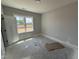 Bedroom with large window and lots of light, waiting on carpet at 107 Tee Dr, Selma, NC 27576