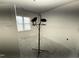 A bright bedroom features neutral walls and a large window for natural light at 107 Tee Dr, Selma, NC 27576