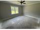 Bright bedroom with window and ceiling fan awaiting personalization at 107 Tee Dr, Selma, NC 27576
