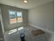 Bedroom featuring a neutral wall color, large windows, and electrical outlets at 107 Tee Dr, Selma, NC 27576