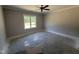 Bedroom featuring a neutral wall color, a ceiling fan, and a large window at 107 Tee Dr, Selma, NC 27576