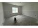 A bright bedroom offers a window bringing light to the interior at 107 Tee Dr, Selma, NC 27576