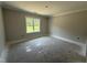 An unfinished bedroom featuring a window at 107 Tee Dr, Selma, NC 27576