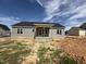 New construction home features gray siding, a dark roof, and a covered front porch at 107 Tee Dr, Selma, NC 27576