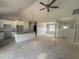 Open floor plan showing bright kitchen with white cabinetry and island at 107 Tee Dr, Selma, NC 27576