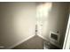 Small laundry room with gray flooring, paint bucket, and hookups at 107 Tee Dr, Selma, NC 27576