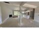 Open-concept living space with fireplace, and kitchen island, providing a modern design at 107 Tee Dr, Selma, NC 27576