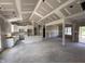 Bright open-concept living and dining area boasting modern design, white cabinets, and ample space at 107 Tee Dr, Selma, NC 27576
