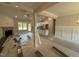 Bright living room featuring a fireplace, ceiling fan, and large windows at 107 Tee Dr, Selma, NC 27576
