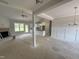 Spacious living room with fireplace, ceiling fan, and bright windows at 107 Tee Dr, Selma, NC 27576
