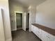 Mudroom featuring tile floor, storage cabinets and access to a closet or pantry at 107 Tee Dr, Selma, NC 27576