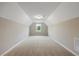 Finished attic space with neutral carpet and a window at 1075 Fairhaven Dr # 51, Mebane, NC 27302