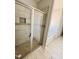 Modern bathroom with tiled shower, glass door, neutral color palette, and a soaking tub nearby at 1075 Fairhaven Dr # 51, Mebane, NC 27302