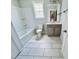 Well-lit bathroom featuring a tub, toilet, and vanity, designed for comfort and style at 1075 Fairhaven Dr # 51, Mebane, NC 27302