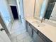 Modern bathroom featuring a sleek vanity, sink, and a separate bathtub area, providing a luxurious experience at 1075 Fairhaven Dr # 51, Mebane, NC 27302