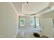 Inviting bedroom with tray ceiling and large windows to allow natural light offers a serene retreat at 1075 Fairhaven Dr # 51, Mebane, NC 27302