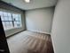 Bright bedroom featuring plush carpeting and a large window offering a lot of natural light at 1075 Fairhaven Dr # 51, Mebane, NC 27302