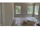 Serene bedroom with three large windows offering peaceful views and plenty of natural light at 1075 Fairhaven Dr # 51, Mebane, NC 27302