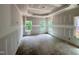 Unfinished bedroom featuring trey ceilings and a window line of sight to wooded backyard at 1075 Fairhaven Dr # 51, Mebane, NC 27302