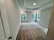 Inviting bedroom with plush carpeting and three windows, offering ample natural light and a comfortable retreat at 1075 Fairhaven Dr # 51, Mebane, NC 27302