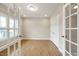 A light filled flex room with hardwood floors and large glass paneled french doors at 1075 Fairhaven Dr # 51, Mebane, NC 27302