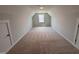Bonus room with carpet and a window perfect for a home office or rec room at 1075 Fairhaven Dr # 51, Mebane, NC 27302