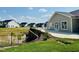 Community amenities with outdoor seating, tables and views of the pond and nearby homes at 1075 Fairhaven Dr # 51, Mebane, NC 27302