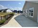 Community amenities with outdoor seating, tables and views of the pond and nearby homes at 1075 Fairhaven Dr # 51, Mebane, NC 27302