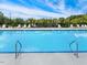 Close up view of the refreshing blue swimming pool with steel railings and a deck area for lounging at 1075 Fairhaven Dr # 51, Mebane, NC 27302