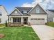 Charming single-Gathering home with a two-car garage and manicured lawn in a desirable neighborhood at 1075 Fairhaven Dr # 51, Mebane, NC 27302