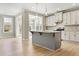 Gourmet kitchen with island, pendant lights, and white cabinetry at 1075 Fairhaven Dr # 51, Mebane, NC 27302