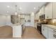 Well-equipped kitchen features an island, stainless steel appliances, granite countertops, and stylish backsplash at 1075 Fairhaven Dr # 51, Mebane, NC 27302