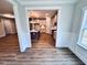 Open concept kitchen with a center island, stainless appliances, and views into living spaces for seamless living at 1075 Fairhaven Dr # 51, Mebane, NC 27302