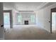 Unfinished living room with fireplace and plenty of natural light at 1075 Fairhaven Dr # 51, Mebane, NC 27302