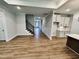 Spacious open floor plan features hardwood floors, seamlessly connecting living, kitchen, and dining areas at 1075 Fairhaven Dr # 51, Mebane, NC 27302