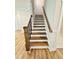 Elegant staircase with dark wood accents and white risers, seamlessly connecting multiple floors at 1075 Fairhaven Dr # 51, Mebane, NC 27302