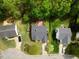 Aerial view of a backyard with a deck surrounded by mature trees at 108 Braxberry Way, Holly Springs, NC 27540